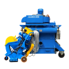 Blue and Yellow Shotblaster in front of large blue dust extractor on four wheels