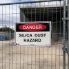 A silica dust hazard sign on a job site
